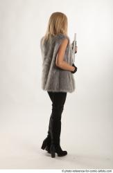 NIKOL STANDING POSE WITH SHOTGUN